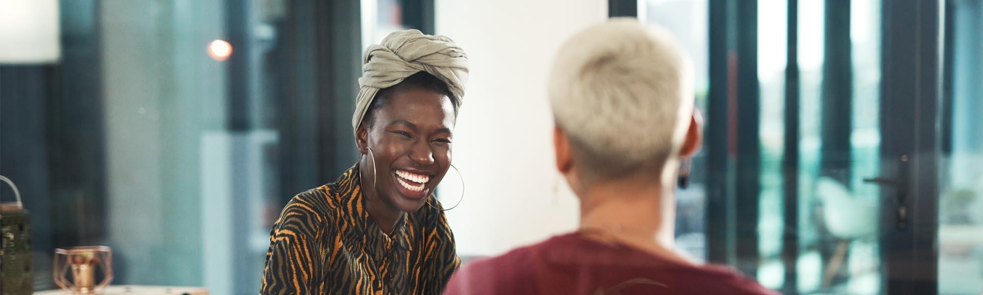 Two people laughing together